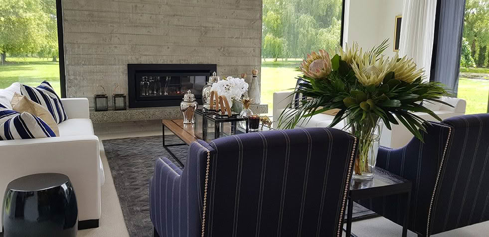 Modern living room with fireplace and garden view