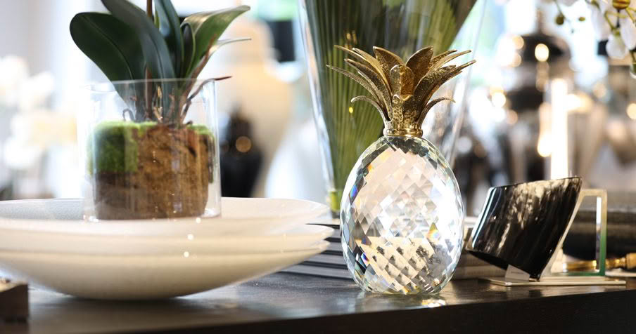 Elegant interior decor with crystal pineapple and plants