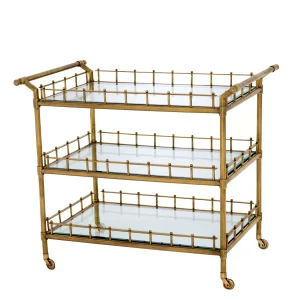 Gold bar cart with glass shelves on wheels