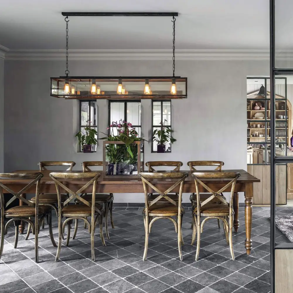 Stylish dining room with wooden table and vintage chairs