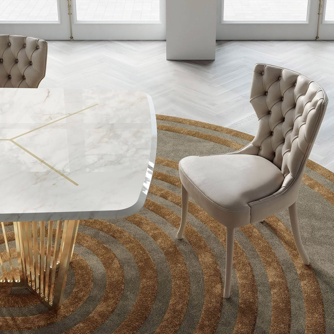Elegant modern dining room with table and tufted chair