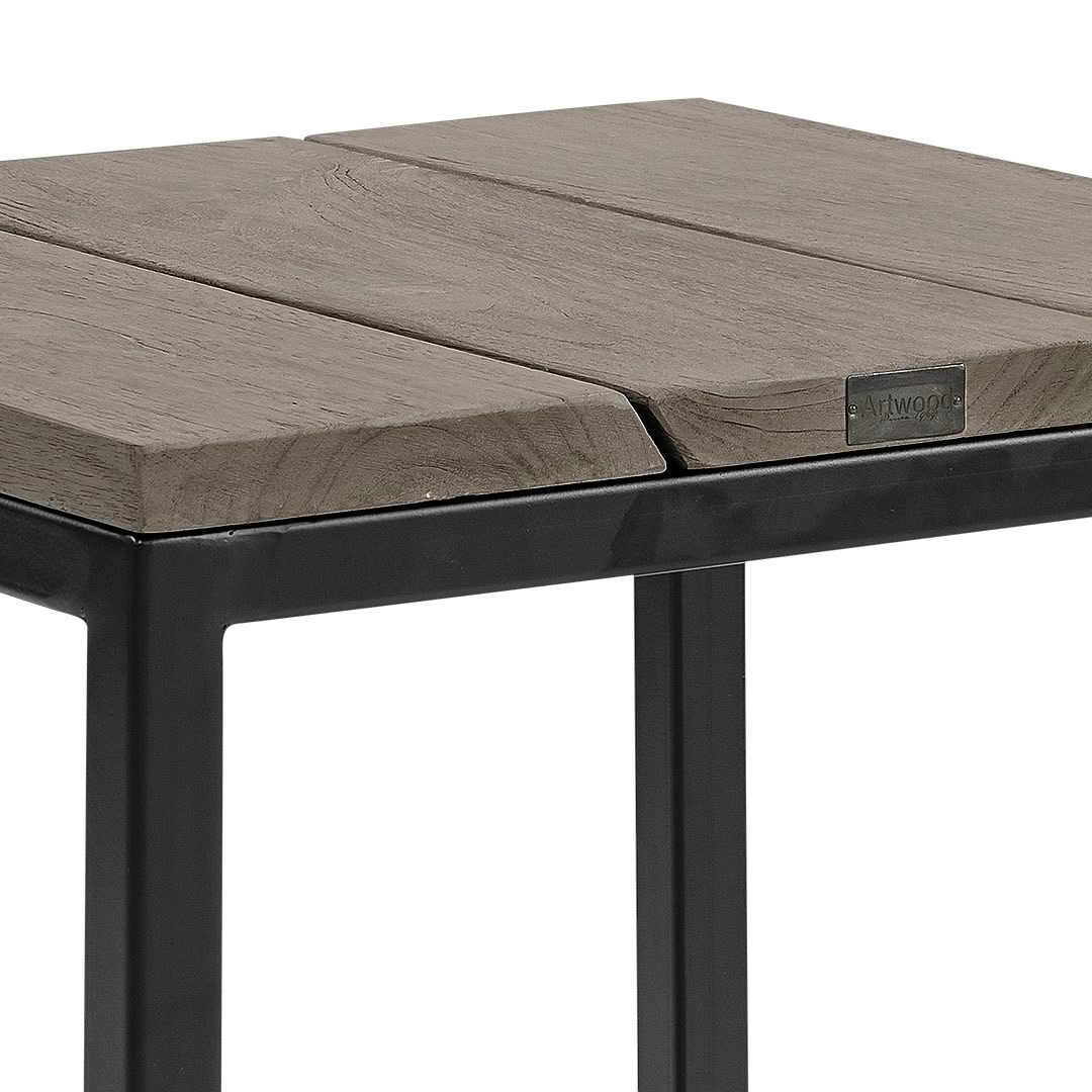 Close-up of wooden table with metal legs.