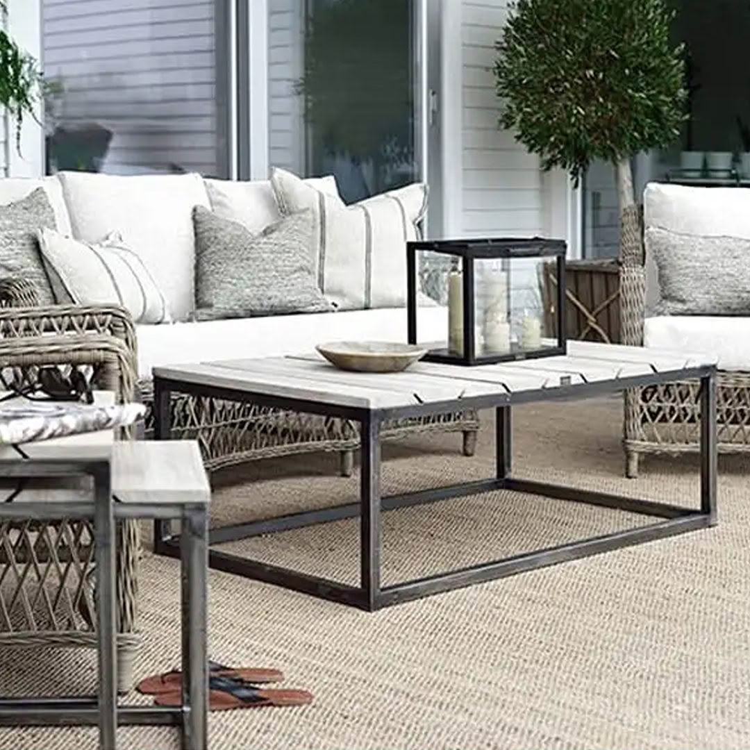 Outdoor patio furniture with cushions and decorative lantern