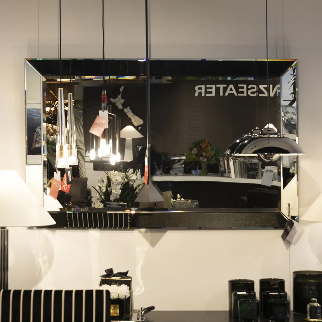 Modern interior with reflective square mirror and decor