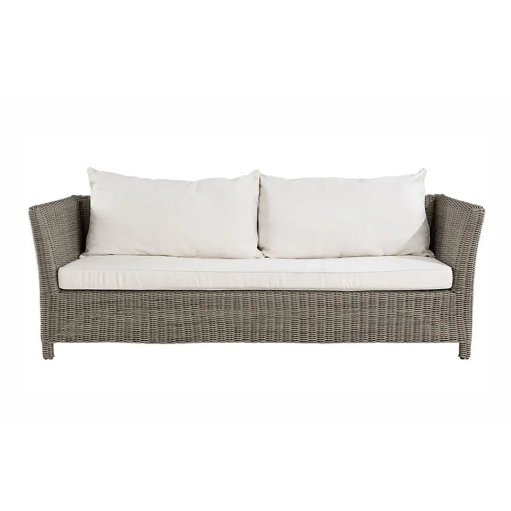 Gray wicker sofa with white cushions