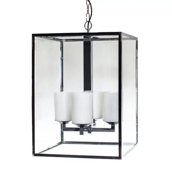 Modern glass chandelier with three white candles