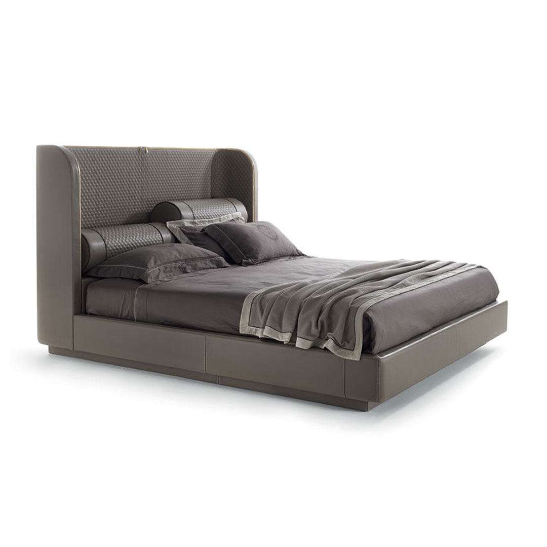 Modern gray upholstered king-size bed with bedding