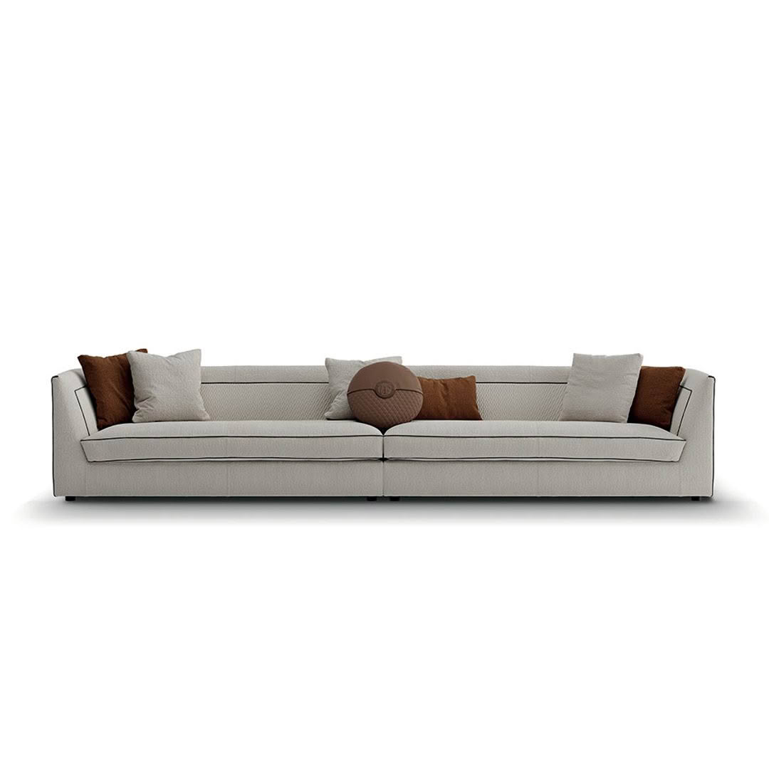 Modern gray sofa with decorative brown pillows