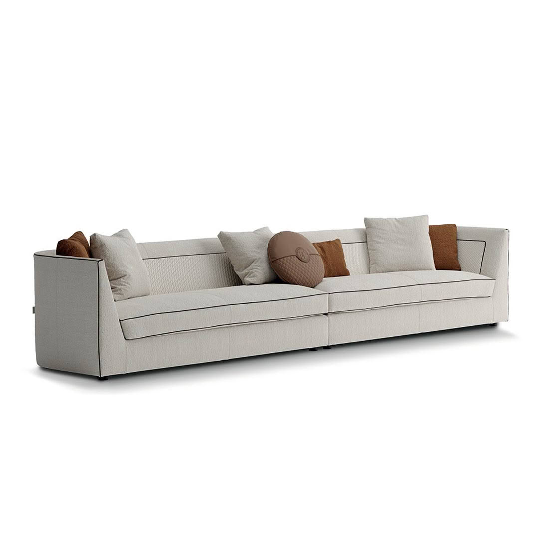 Modern beige sofa with decorative pillows