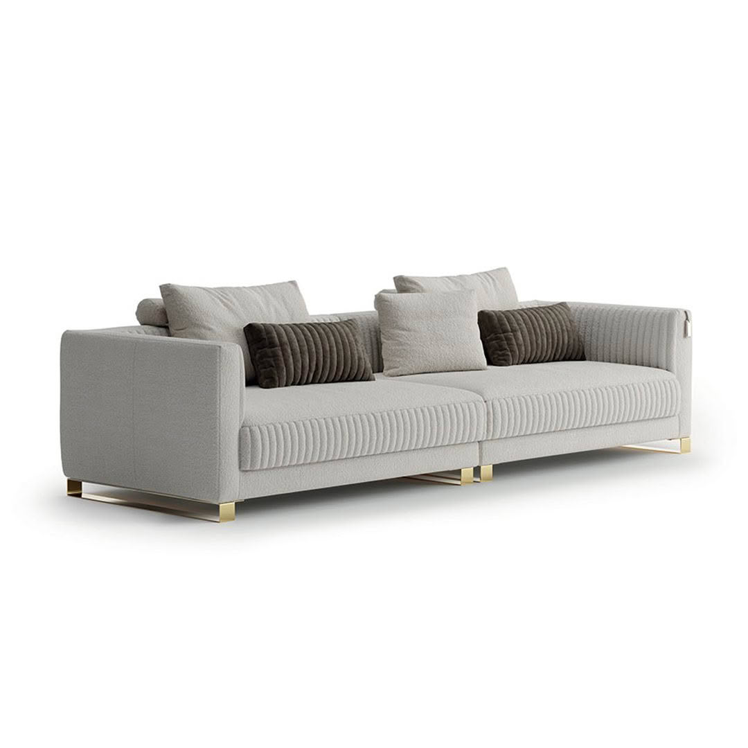 Elegant gray sofa with cushions and gold accents