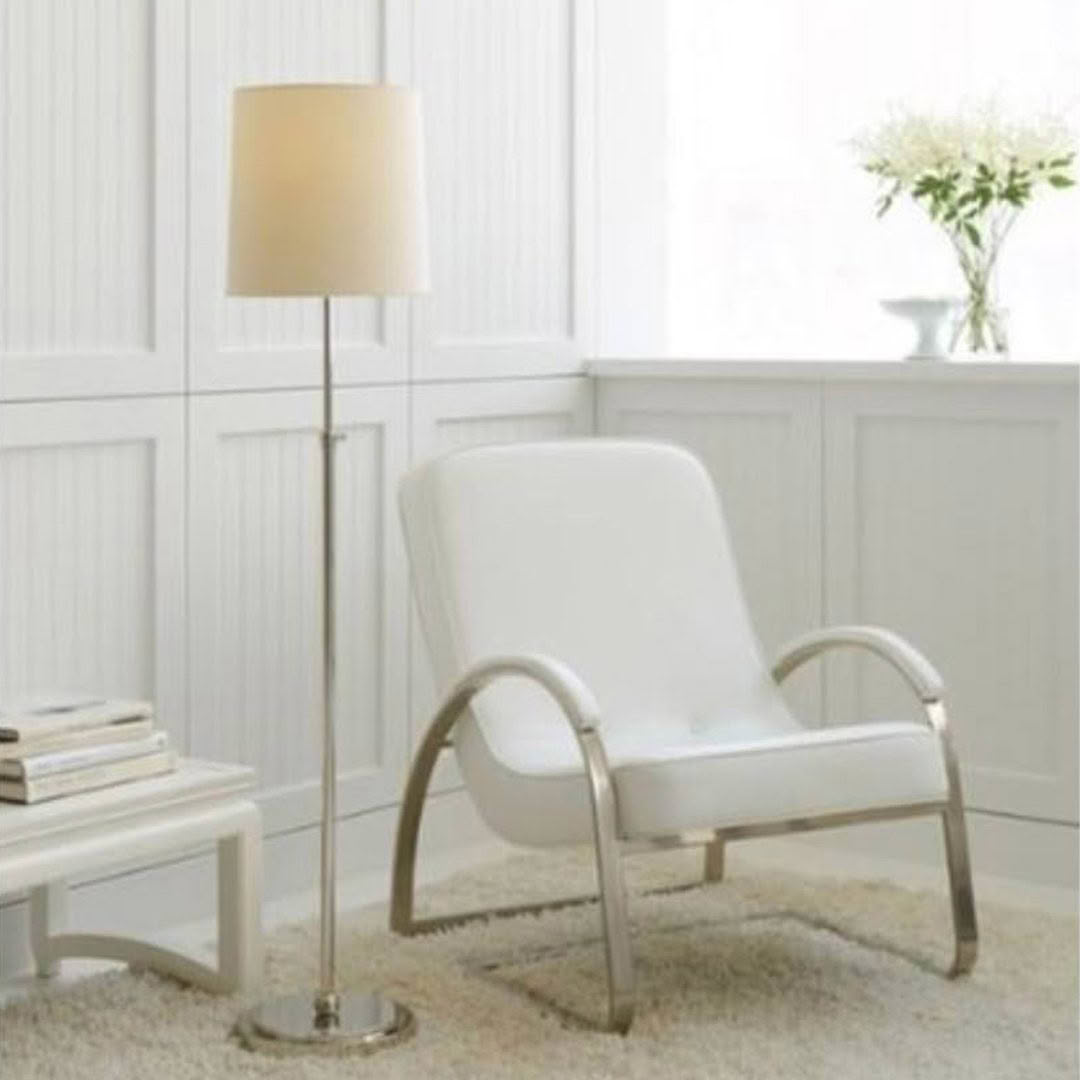 Modern white chair with floor lamp in elegant room