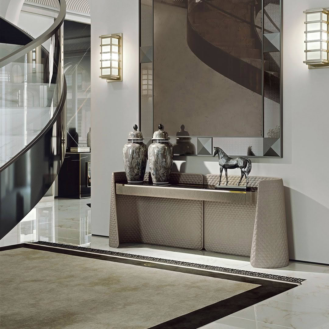 Luxurious foyer with decorative mirror and elegant furnishings