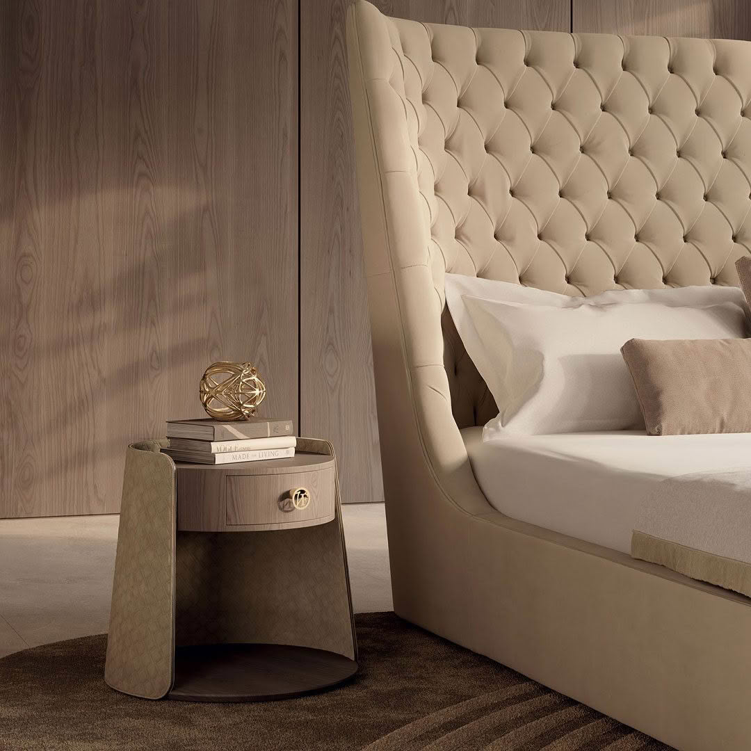 Luxurious bedroom with tufted headboard and stylish nightstand
