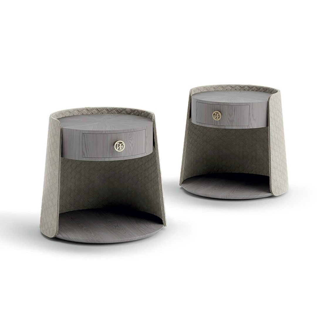 Two gray woven leather storage baskets on white