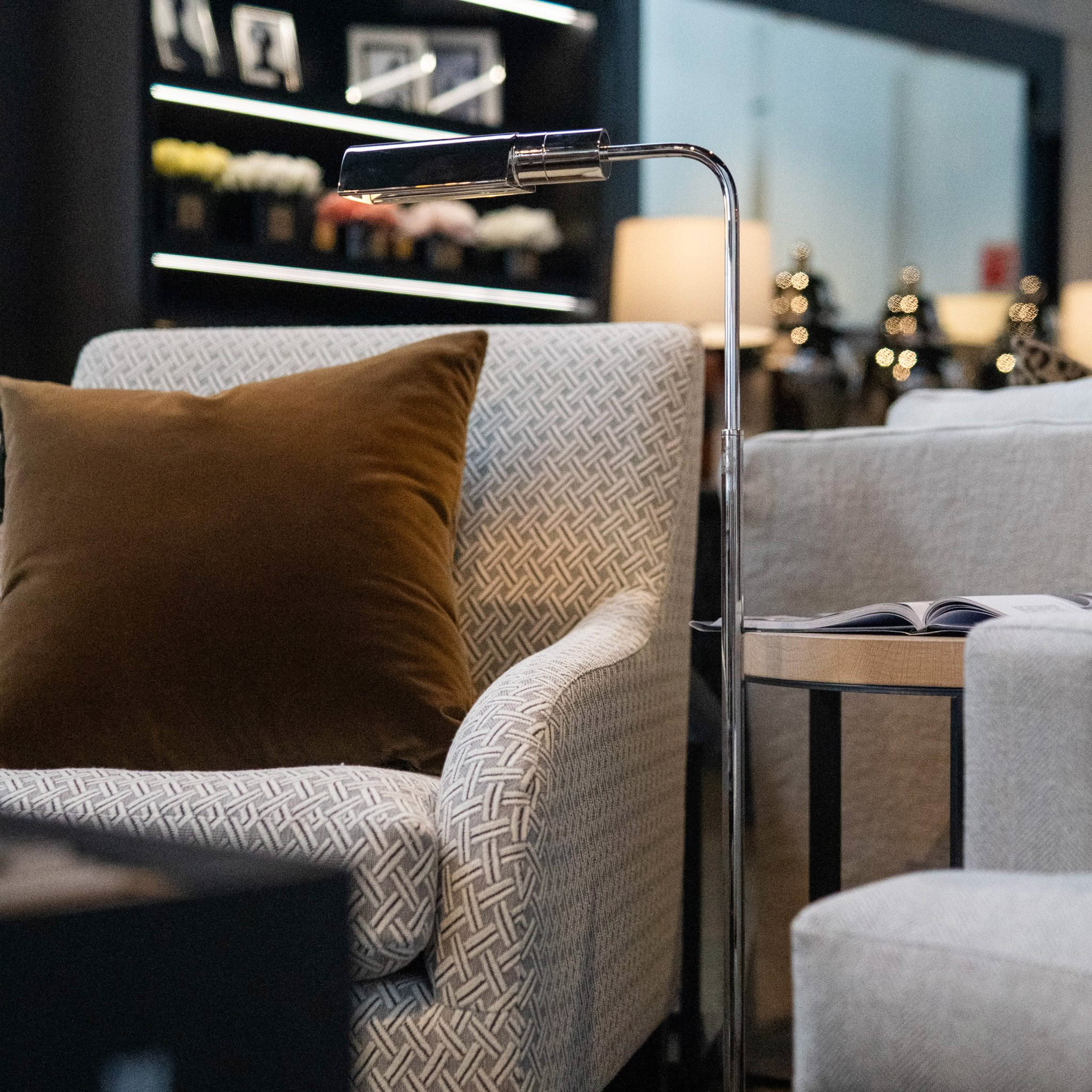 Stylish living room with chic armchair and elegant lamp