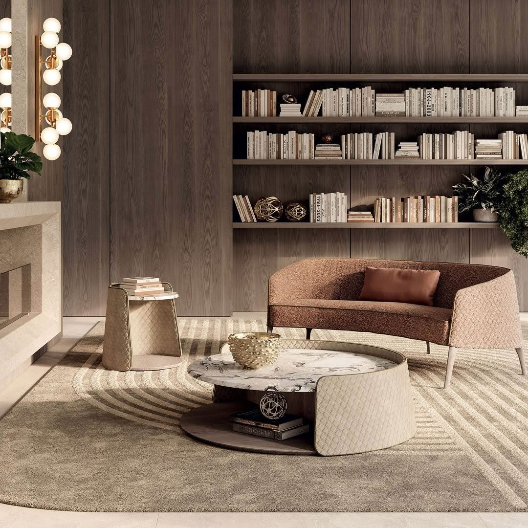 Elegant living room with modern furniture and bookshelves.