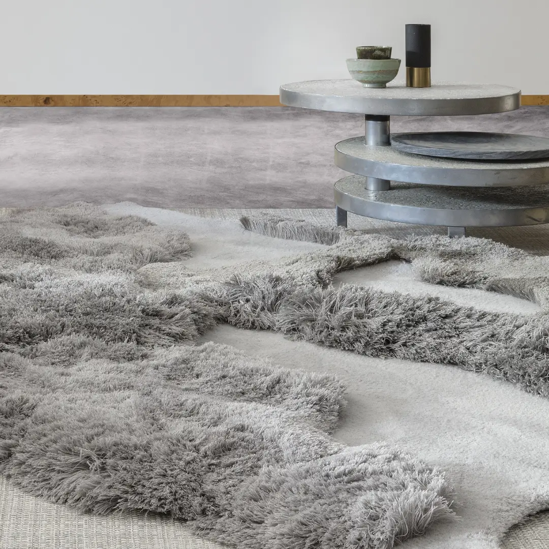 Cozy_2 Modern interior with textured rug and tiered coffee table