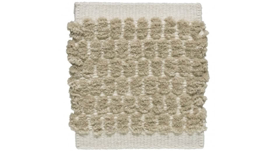 Textured white shag rug with raised tuft patterns
