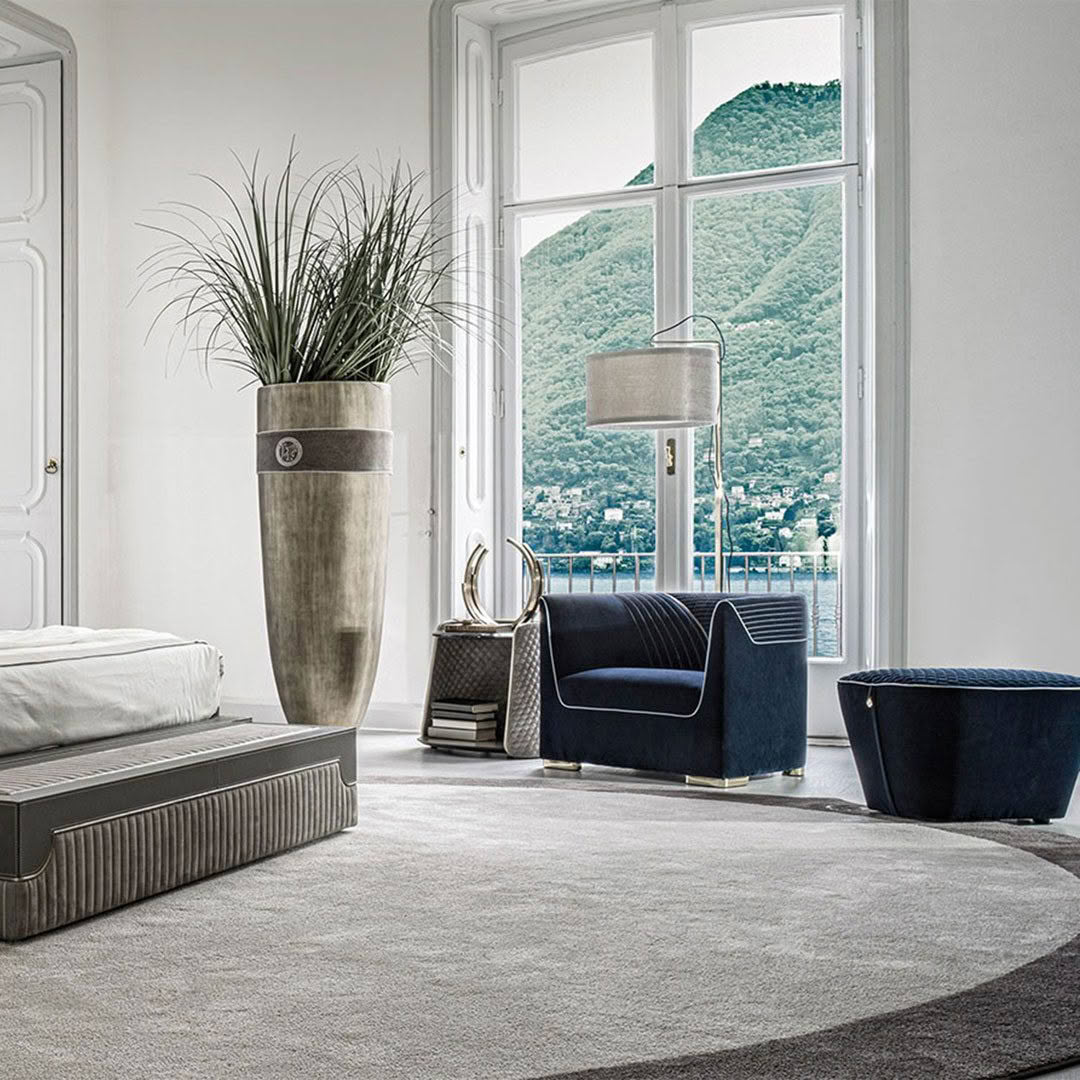 Elegant room with lake view, modern furniture, and plants