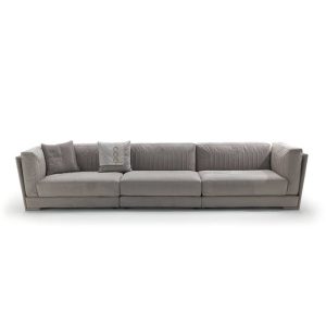 Gray sectional sofa with cushions on white background