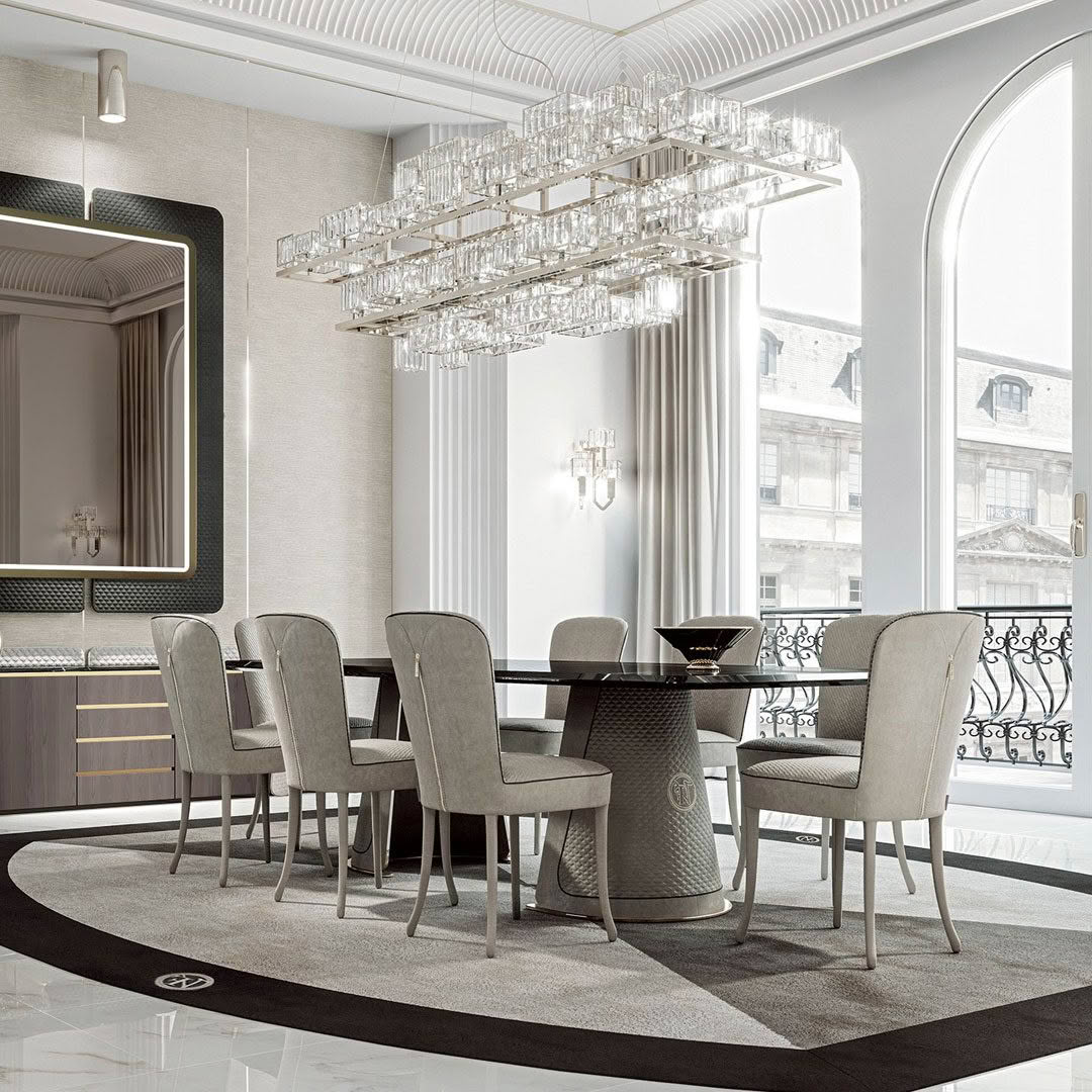Elegant dining room with large chandelier and city view