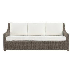 Wicker outdoor sofa with white cushions