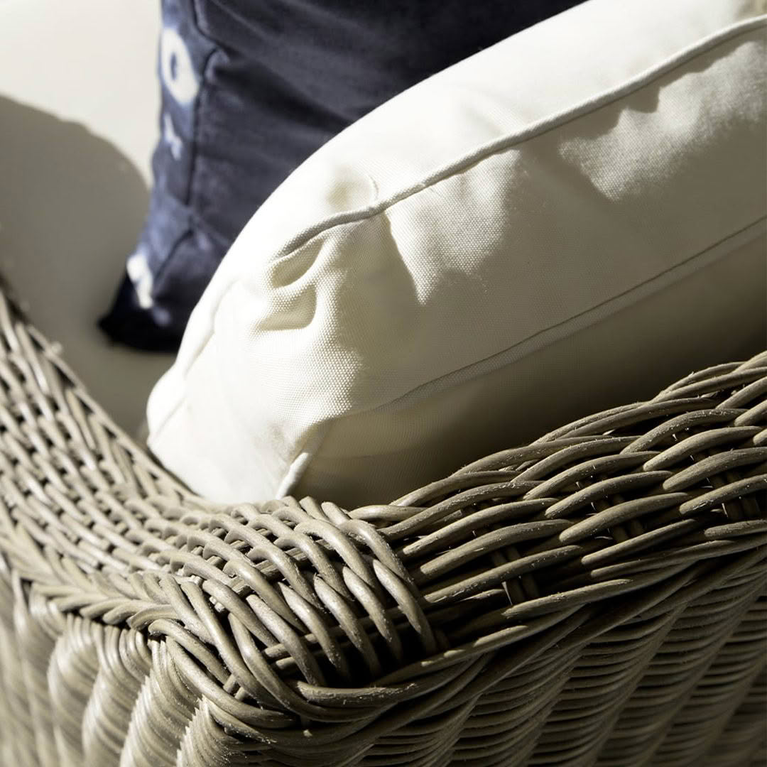 Close-up of woven basket with decorative pillows