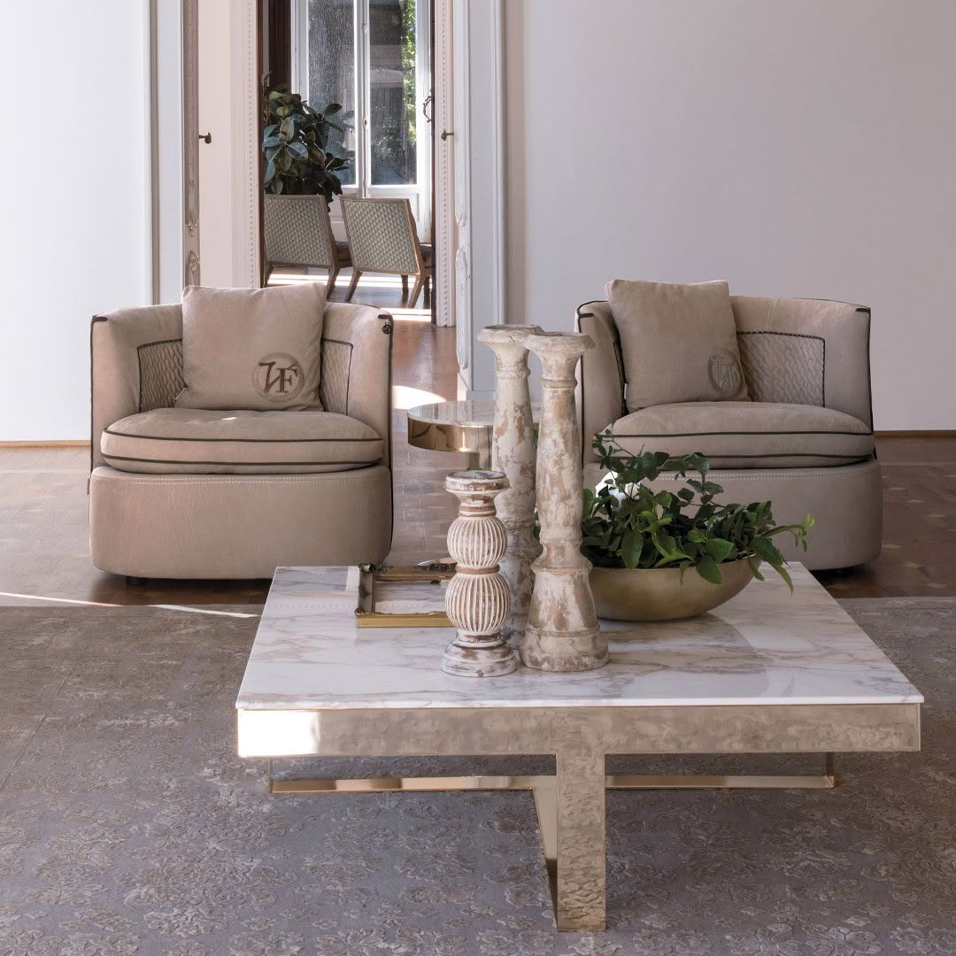 Elegant living room with plush sofas and marble table