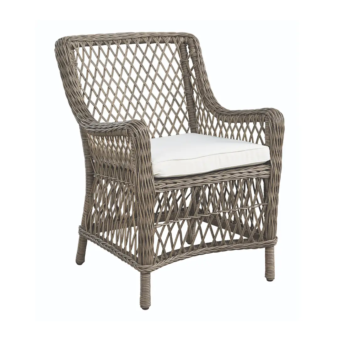 Wicker armchair with white cushion isolated on white