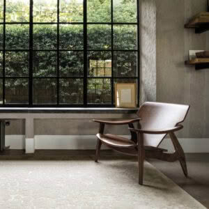 Modern room with wooden chair by large window
