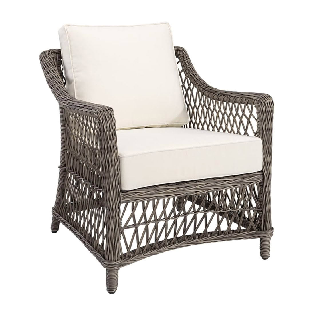 Wicker armchair with white cushions isolated on white