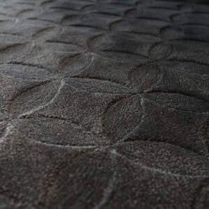 Close-up of textured dark fabric with embossed pattern