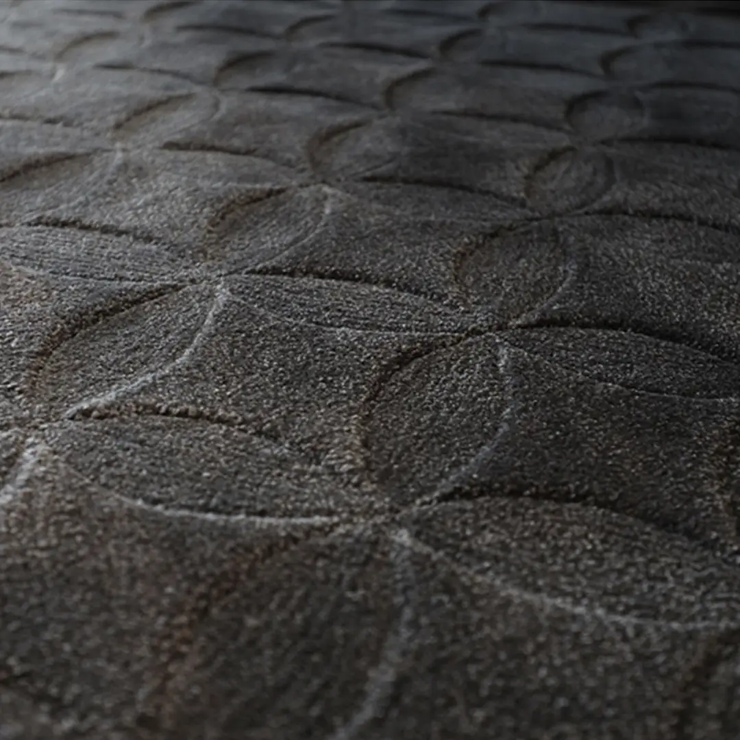 Close-up of textured dark fabric with embossed pattern