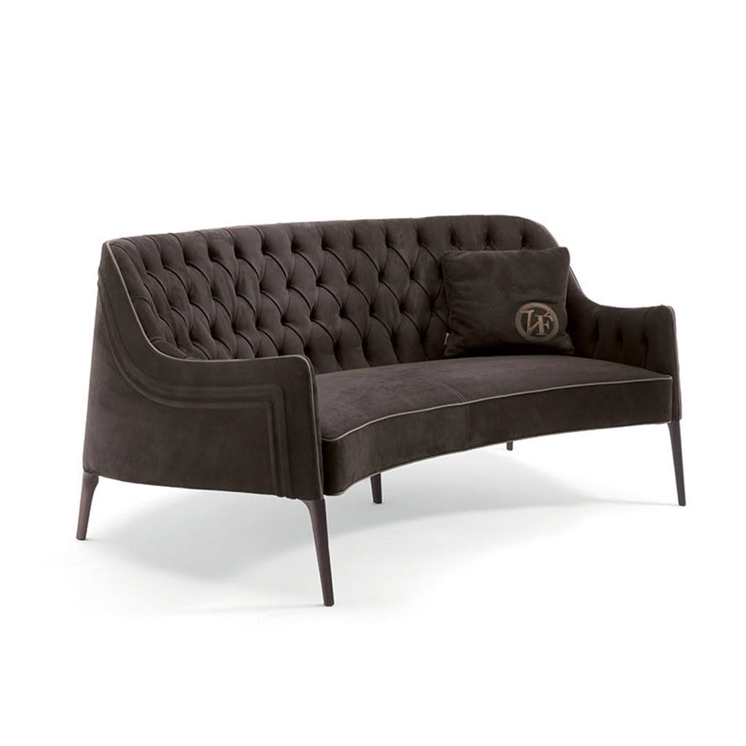 Elegant tufted charcoal grey velvet sofa on white background