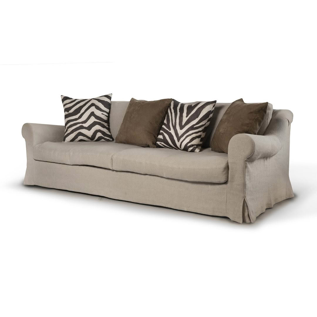 Beige sofa with zebra-striped and brown cushions