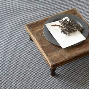 Rustic wooden table with ceramic plate and dried berries