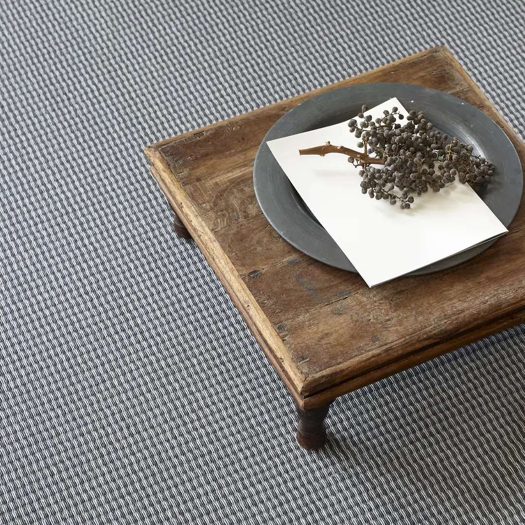 Rustic wooden table with ceramic plate and dried berries