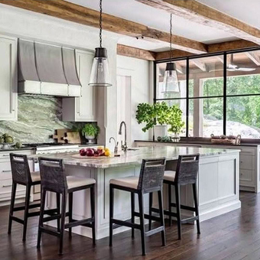 Modern kitchen with wooden beams and marble island