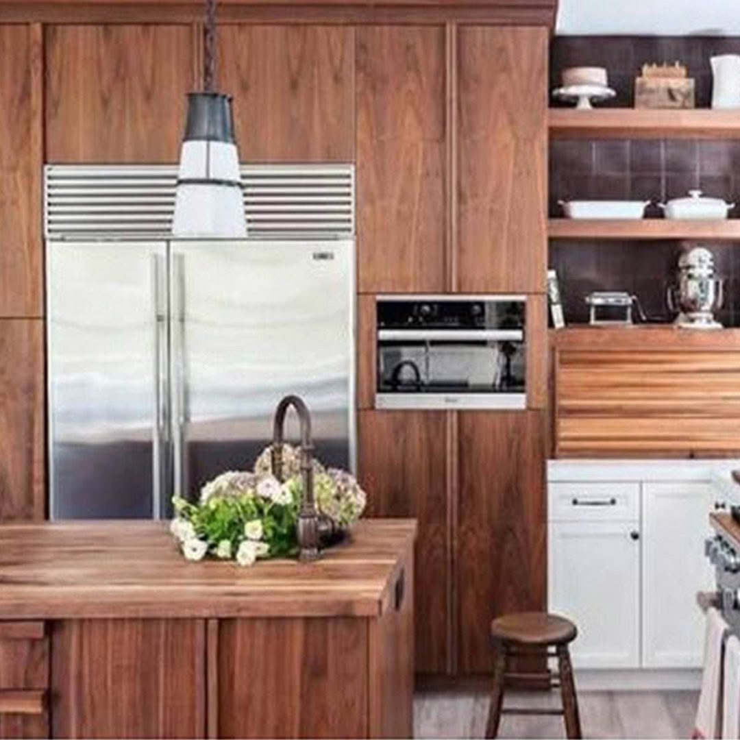 Modern kitchen with wooden cabinets and stainless steel appliances