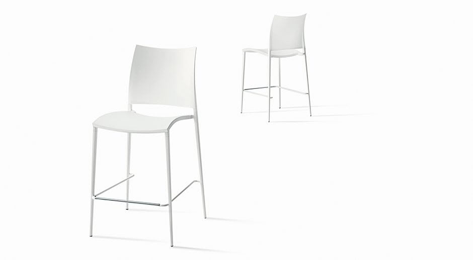 Two modern white chairs, one standard and one high.