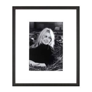 Black and white portrait of smiling woman outdoors