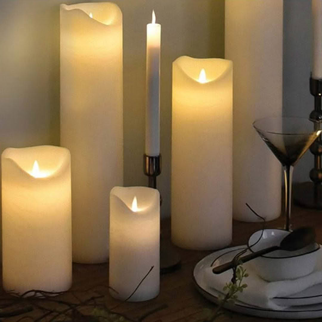 Candles and cocktail glass on cozy evening