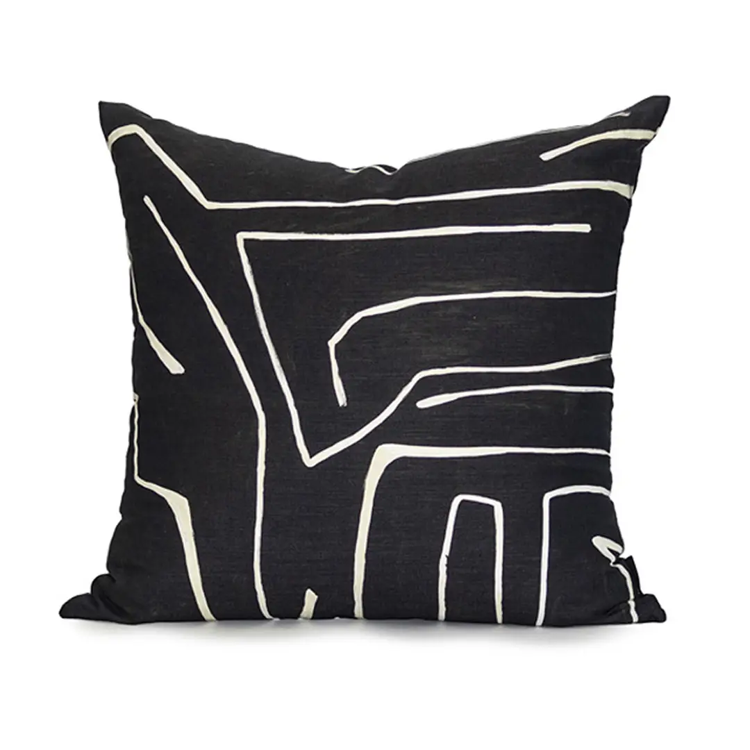 Black pillow with abstract white lines design