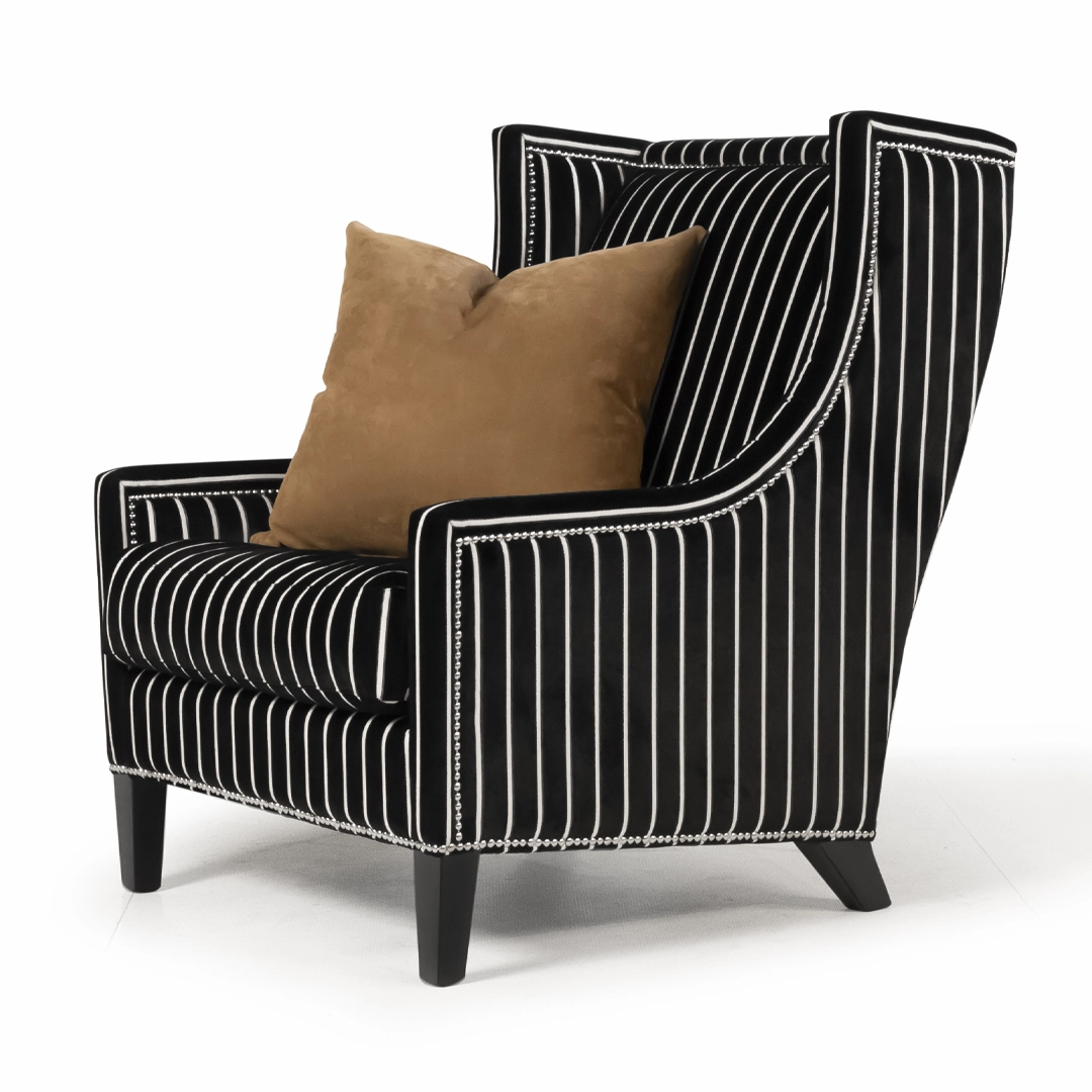 Elegant striped armchair with brown accent pillow