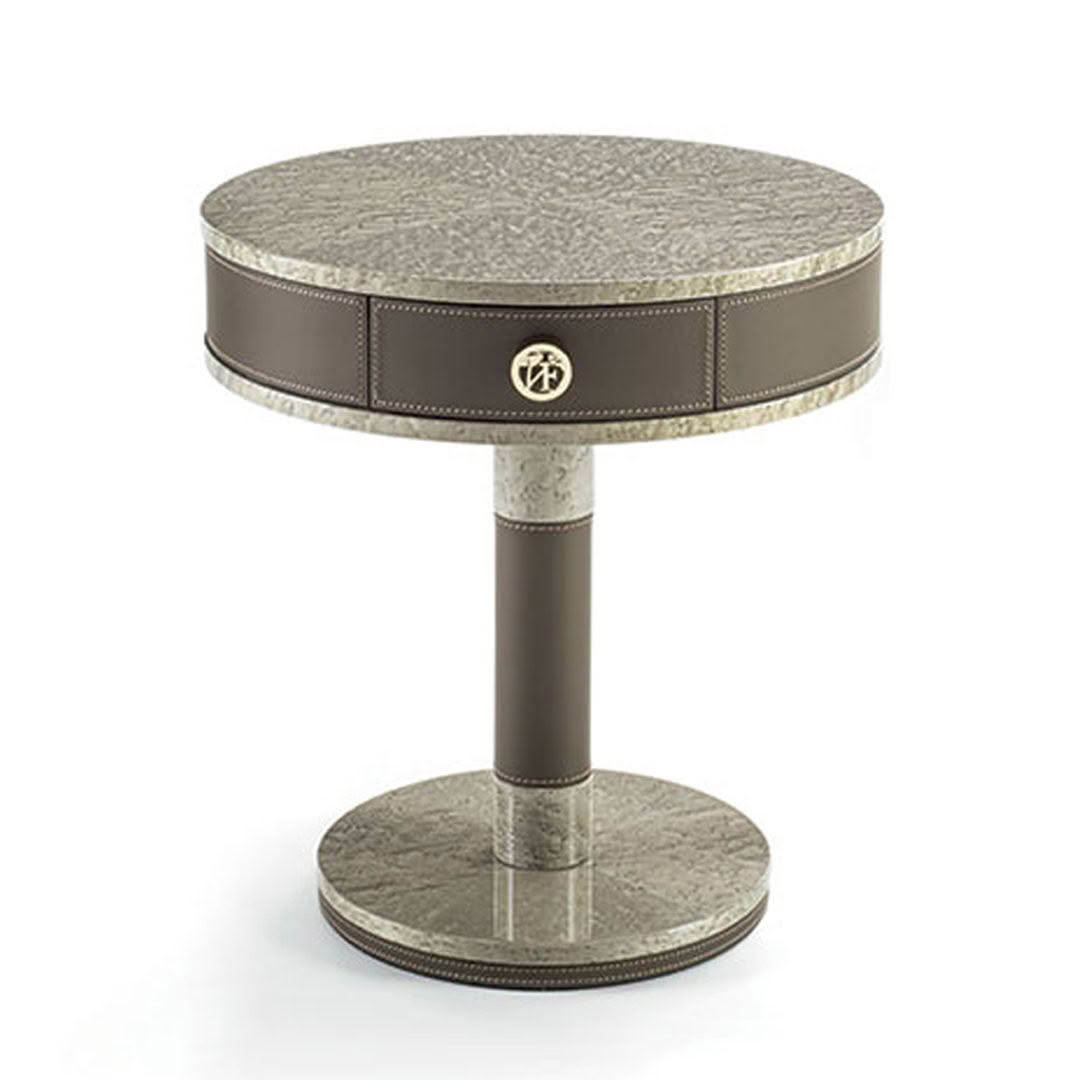 Elegant round table with textured top and metal details
