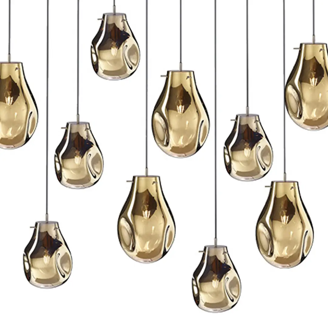 Modern gold pendant lights hanging in a pattern