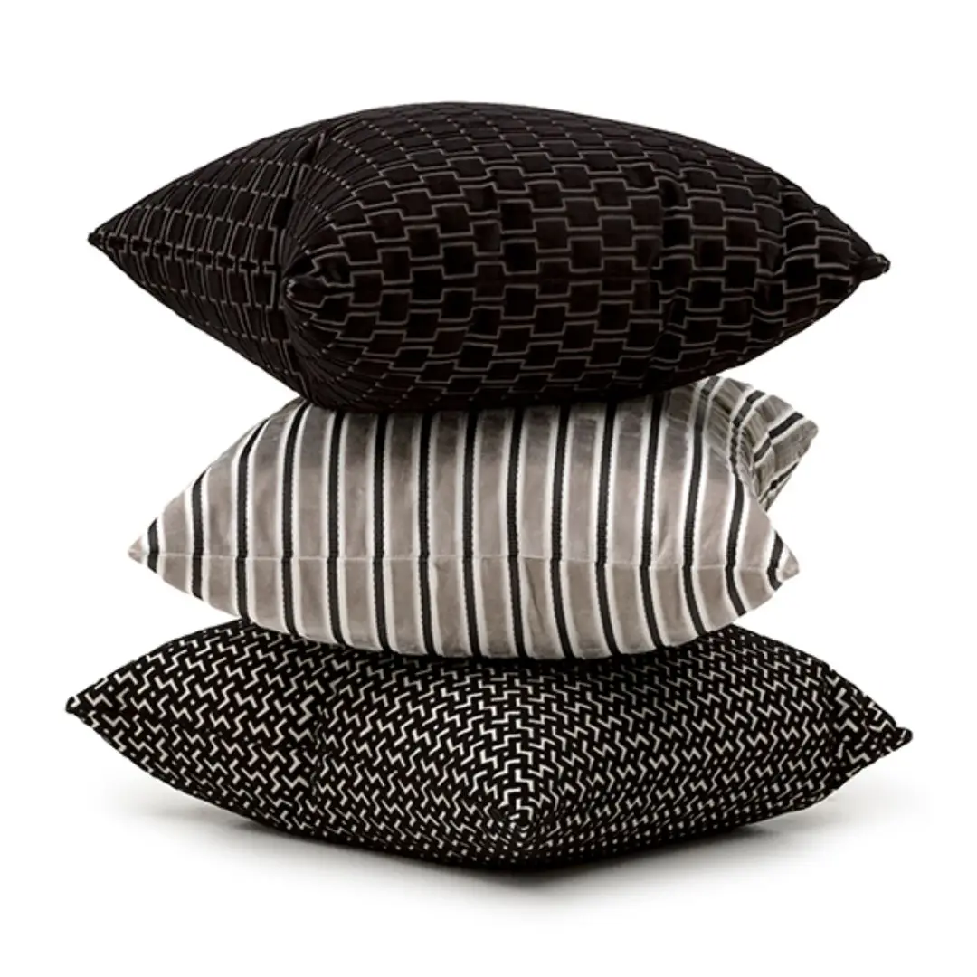 Stack of three stylish decorative pillows