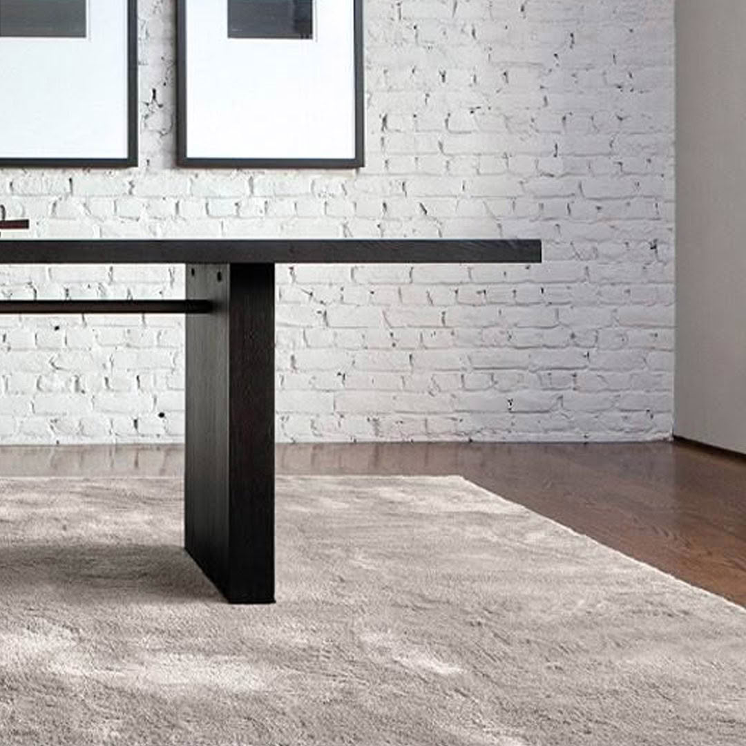 Modern room with white brick walls and wooden table