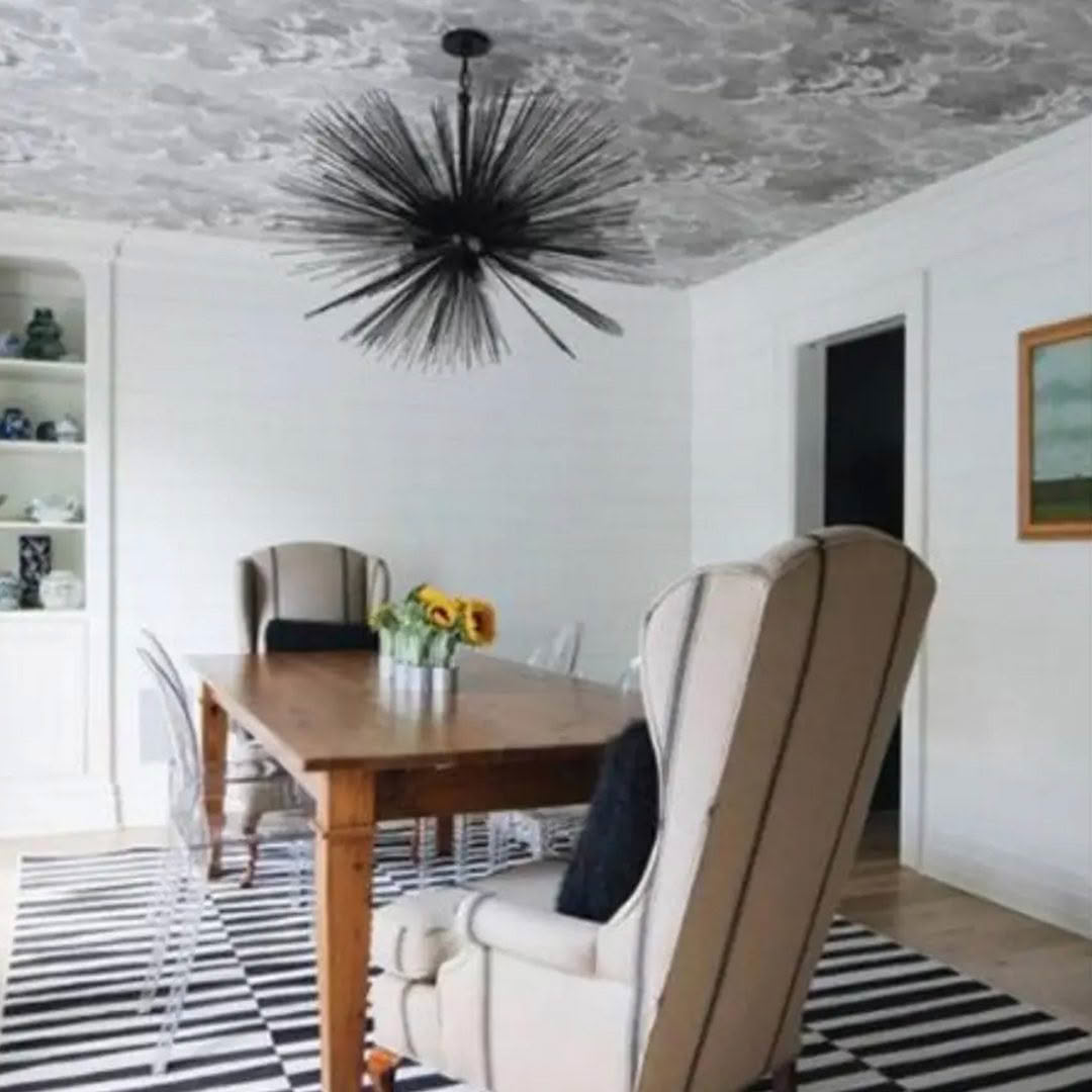 Elegant dining room with unique ceiling light fixture