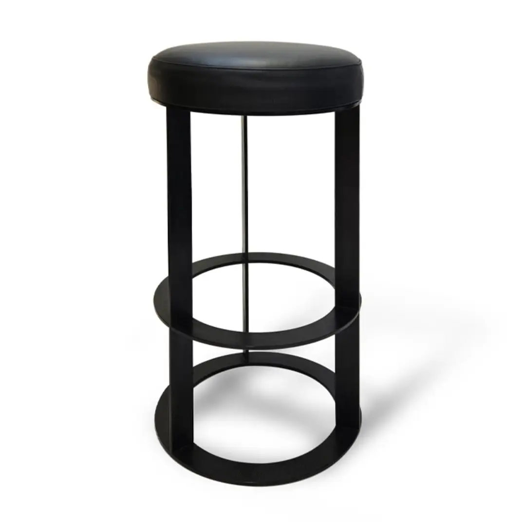 Black modern bar stool with round leather seat.